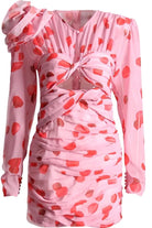 Polka dot print ruched mini dress featuring a rose corsage on the shoulder and front cut out. The dress is lined and has a  zip fasten on the back. This chiffon print is red and pink..