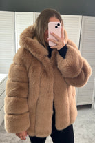 Premium faux fur hooded coat in camel | tan.  This luxury faux fur hood jacket is designed to keep you warm in cold weather. Crafted from a premium faux fur material, it is both soft and durable.