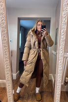 Oversized Long Tie Waist Duvet Coat in Camel. Wrap yourself in warmth and style with our Oversized Long Tie Waist Duvet Coat in Camel. The top to bottom button fasteners and removable tie around belt offer convenience and versatility.